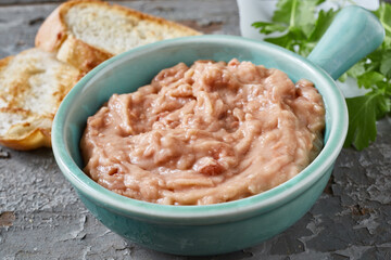 Tasty bean pate in bowl on table