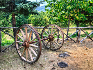 Fototapeta na wymiar An old wooden cart and wheels