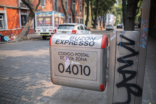 Silver mailbox in Coyoacan, Mexico City with street as background