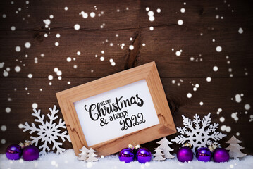 Fototapeta na wymiar Frame, Purple Ball, Tree, Snow, Snowflakes, Merry Christmas And A Happy 2022