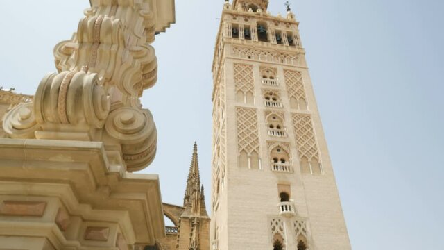View from the bottom to the top of the famous Giralda tower of the Seville cathedral. This is the old minaret of the previous mosque. Andalusia, Spain.