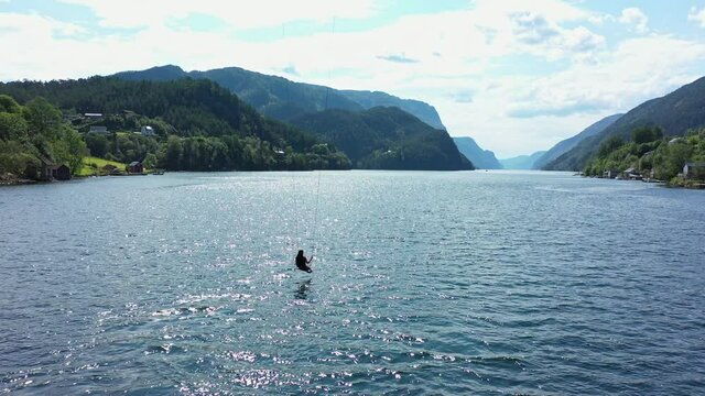 Incredible experience riding swing above sea surface with panoramic view of Veafjorden in Norway