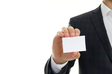 Businessman holds blank business card, isolated on white background