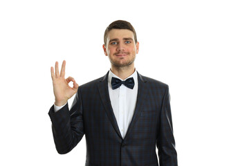 Businessman shows ok sign, isolated on white background