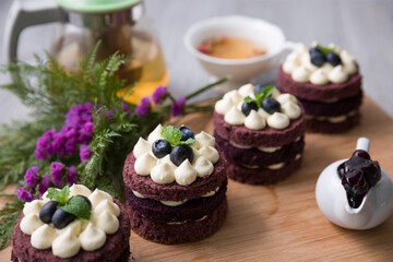 Blueberry cheesecake on wooden table, birthday party, corporate event or wedding celebration