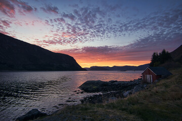 Sunset on the fjord of Selje Norway. very beautiful colors reflected in the clouds and the water