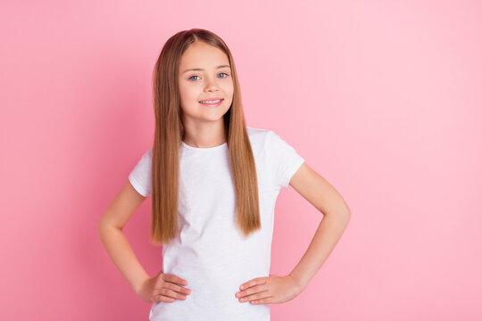Photo of nice blond little girl wear white t-shirt isolated on pink color background
