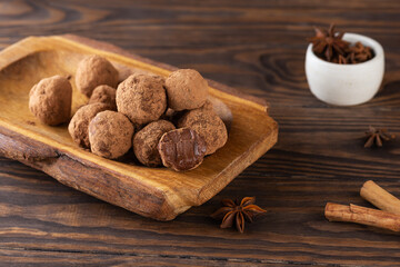 Homemade truffles with anise and cinnamon on a brown background. Sugar, gluten and lactose free, healthy diet, vegan.