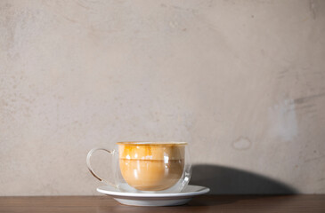 cup of coffee on wooden table