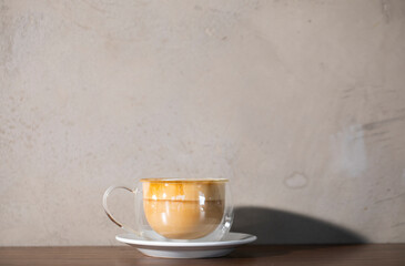 cup of coffee on wooden table