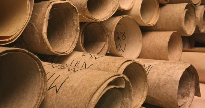 Scrolls stacked on a pile. Medieval manuscripts library. 