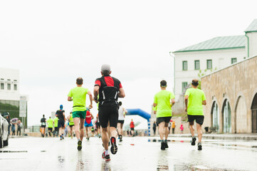 Man approaching the finish line of the marathon distance