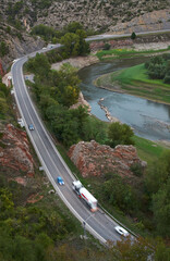 Highway with moving cars and a truck