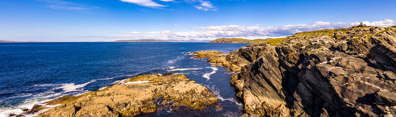 Fototapeta na wymiar Aerial view of the Dawros coast with Dunmore head by Portnooin background, Rossbeg and Dawros head in County Donegal - Ireland.