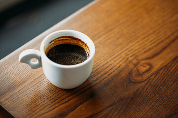 cup of coffee on wooden table
