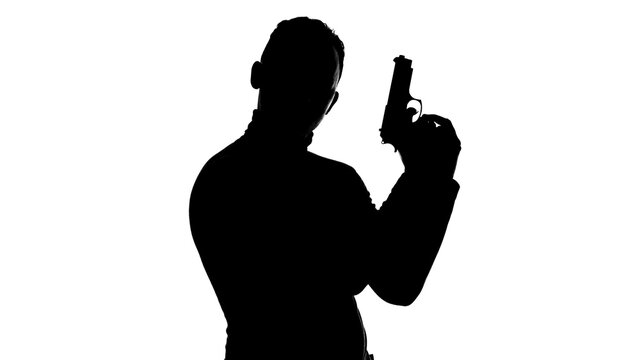 Image of the man's silhouette with handgun