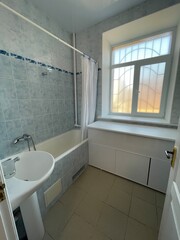 modern bathroom with window and bath