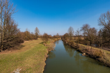 Fototapeta na wymiar Odra river with trees and meadow around in CHKO Poodri in Czech republic