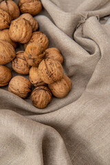 Walnuts on light textile background