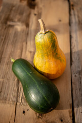 Ripe Pumpkins In rustic wooden table At Sunset