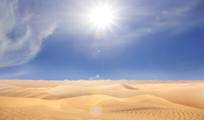 Picturesque view of sandy desert and blue sky on hot sunny day