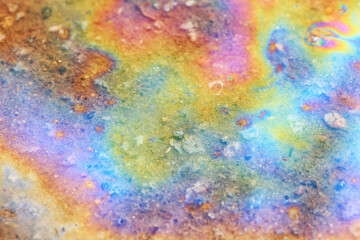 spilled gasoline rainbow background, industrial hazard spill pollution, abstract texture multicolored
