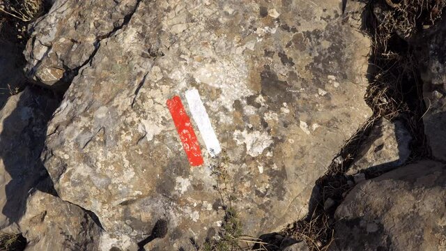 Red and white markers of the GR path that mark out the traditional french hiking trails on the Montagne Sainte-Victoire trail