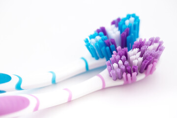 Toothbrushes on a white background. Oral hygiene. Male and female couple, family hygiene and relationships.