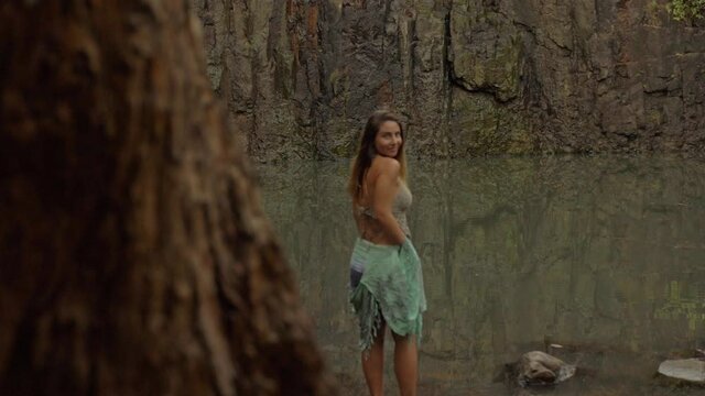 Lovely Tourist Standing On The Pool Behind Woods - Cedar Creek Falls In QLD Australia. Dolly Shot
