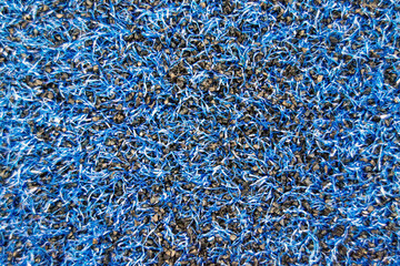 the texture of the artificial lawn is blue. Close-up coverage of the stadium