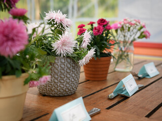 Wooden table with flowers and name cards