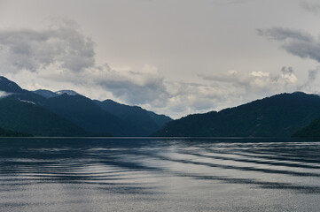 Beautiful panoramic view at Kucherla mountain lake and mountain range. Belukha national park, Altai...