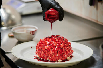 Chocolate pumpkin cupcake, decorated with icing in shape of brain. Selective focus. From series...