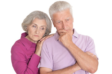Portrait of sad senior couple isolated