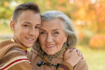 grandmother  and grandson  smiling in park