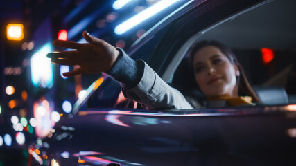 Female is Commuting Home in a Backseat of a Taxi at Night. Passenger Chilling and Holding Her Hand...