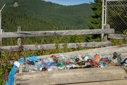 Vorohta, Ukraine – September 6, 2021: A lot of plastic bottles and other rubbish, trash, litter outdoors in the mountains