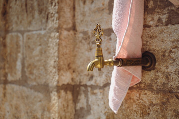 closeup of vintage bronze water faucet