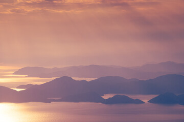 beautiful aerial panorama of mountains islands and sea at sunset