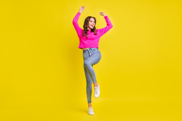 Fototapeta na wymiar Full body photo of young attractive girl happy positive smile have fun dance isolated over yellow color background