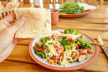 Armenian lavash and caesar salad in restaurant