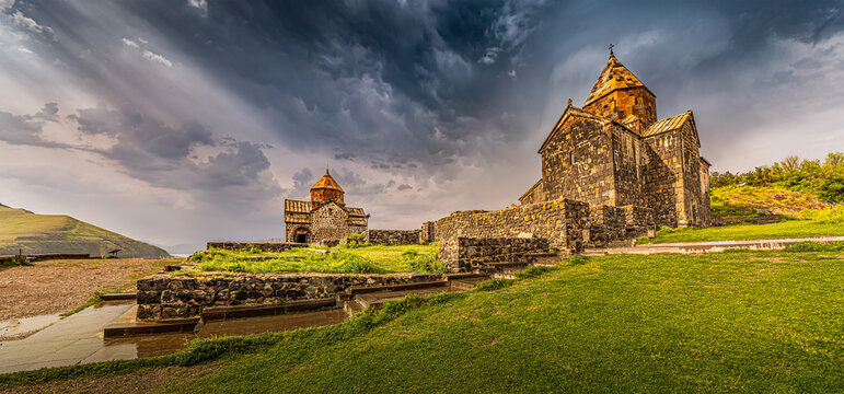 Panoramic view of Sevanavank Monastery on the shore of Lake Sevan as the symbol and tourist attraction of Armenia and the entire Transcaucasia in stormy weather