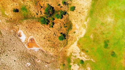 Top down view orange heart shape form on mud volcanoes site in chachuna nature reserve, VAshlovani national park, Georgia