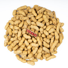 Raw peanuts in the skin on a white isolate.