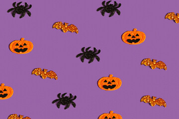 Creative purple pattern made of pumpkin, bat and spiders. Halloween concept Flat flat, top view, copy space