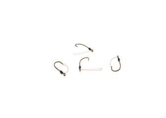Four stainless weedguard baitholder hooks with long shank bronze finish fishing tackle isolated on white