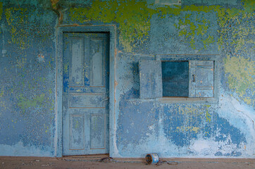 A room with a blue vintage background and a window