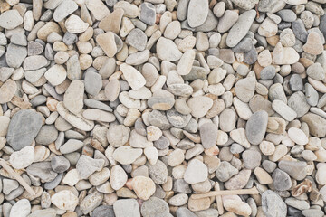 Background of stones on the beach. Background in gray shades. A place for text.