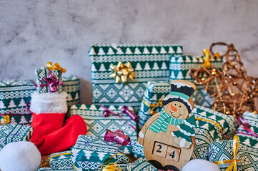 Wrapped gifts that are part of an advent calendar and Christmas decorations.