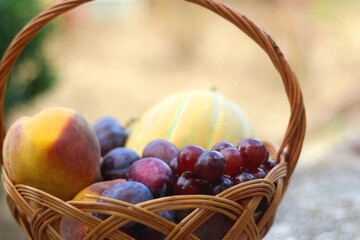 Vintage basket filled with various fruit. Selective focus.